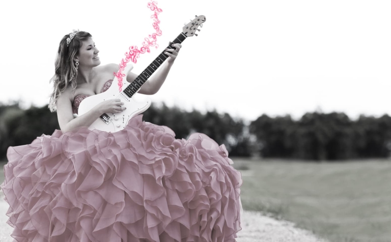 Quinceanera playing the guitar