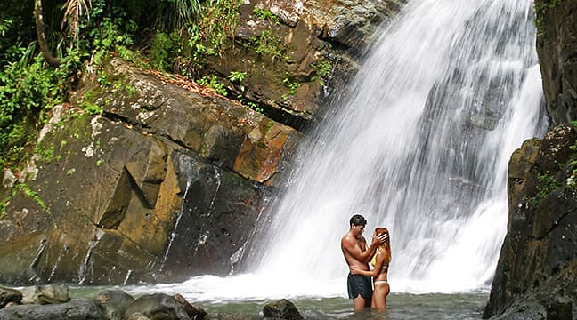 Couple at La Mina waterfall in El Yunque