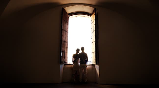 Engagement session at St. Cristobal Castle window in Old San Juan, Puerto Rico