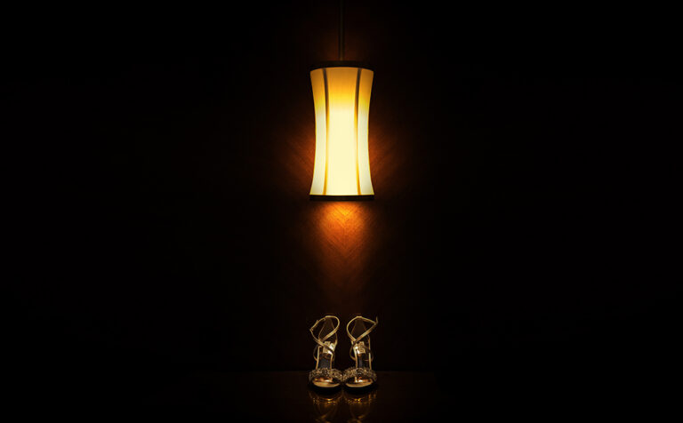 Wedding shoes in dark background under the lamp