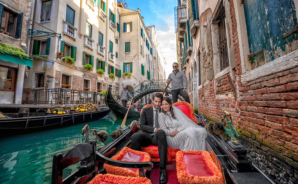 Couple in a gondola at Venice Canal, Italy