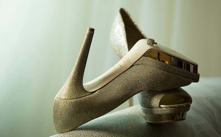 Wedding Shoes and wedding rings in a sofa